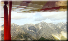 Mountains under my wing near Muncho, British Columbia.